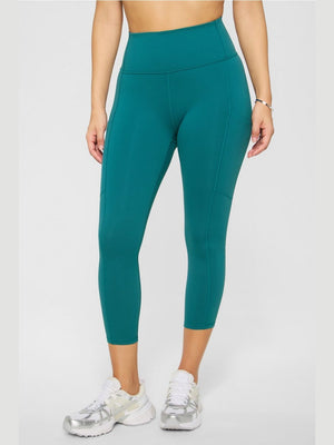 Fabletics teal high-waisted capri leggings with side pocket and seamless knit fabric