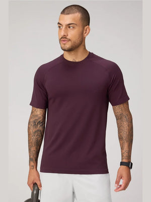 Fabletics Training Day Tee in deep burgundy with seamless second-skin compression fit and raglan sleeves for men's workouts