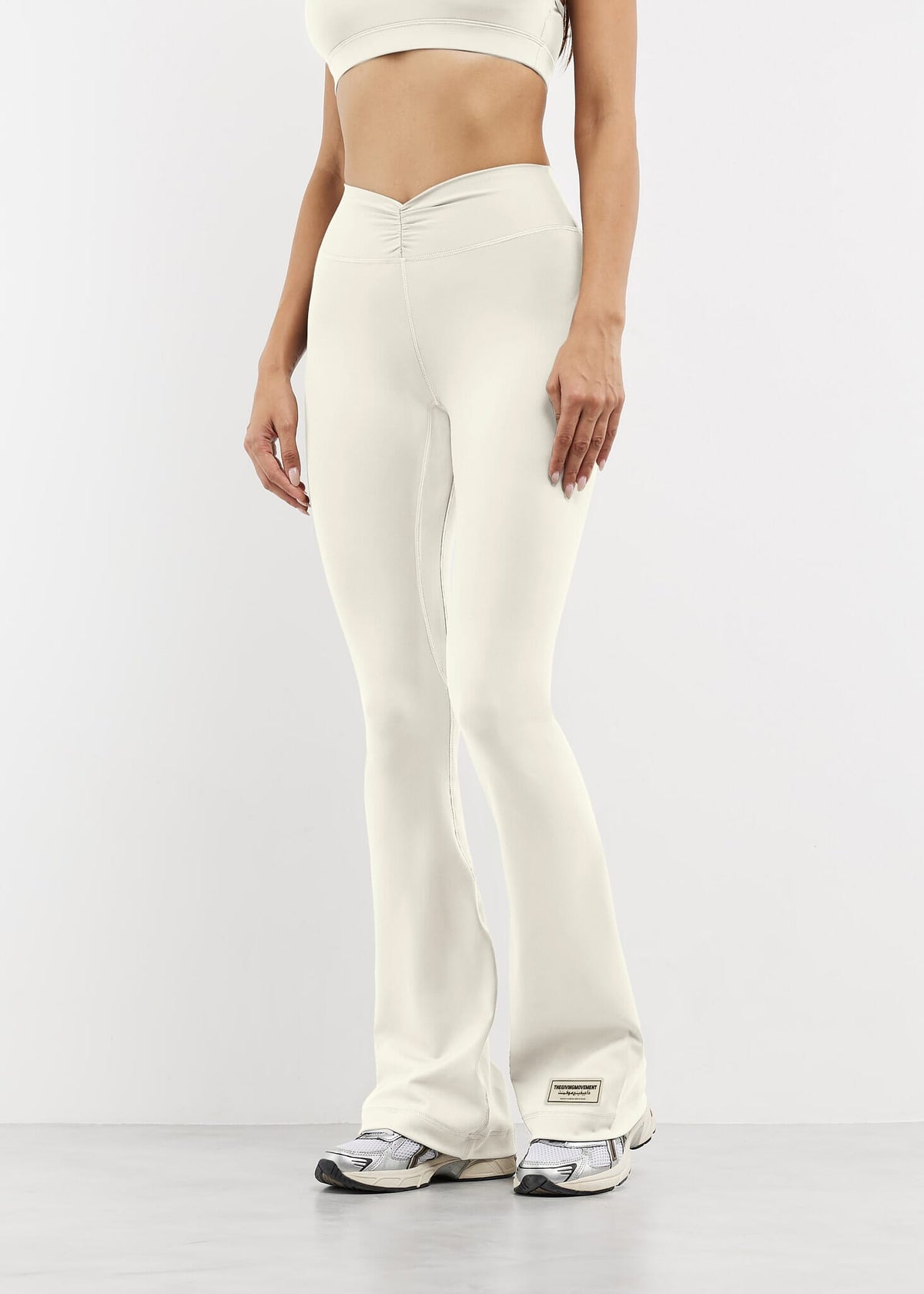 THE GIVING MOVEMENT SOFTSKIN FLARED FRONT SPLIT LEGGING- REGULAR